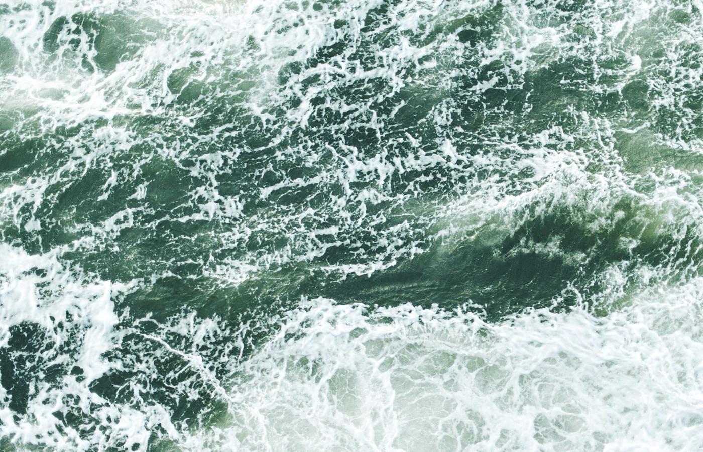 An open book with diagrams of orbital mechanics